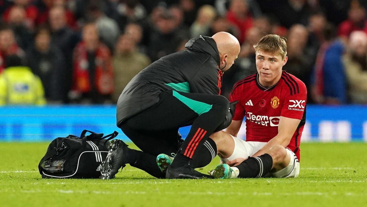 Manchester United's Rasmus Hojlund receives treatment for an injury.