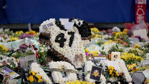 <p>Floral tributes outside the Motorpoint Arena, Nottingham after Adam Johnson’s death. Pic: Zac Goodwin/PA</p>