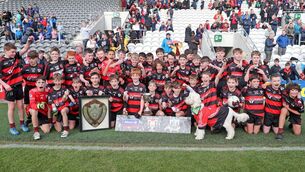 <p>SCIATH SUCCESS: St. Anthony's Ballinlough  celebrate their F1 final victory with the assistance of Kali the dog.</p>