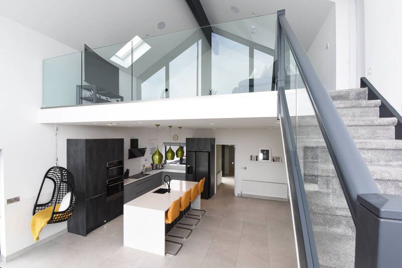 Lofty main living with first floor mezzanine for the views and light Lofty main living with first floor mezzanine for the views and light