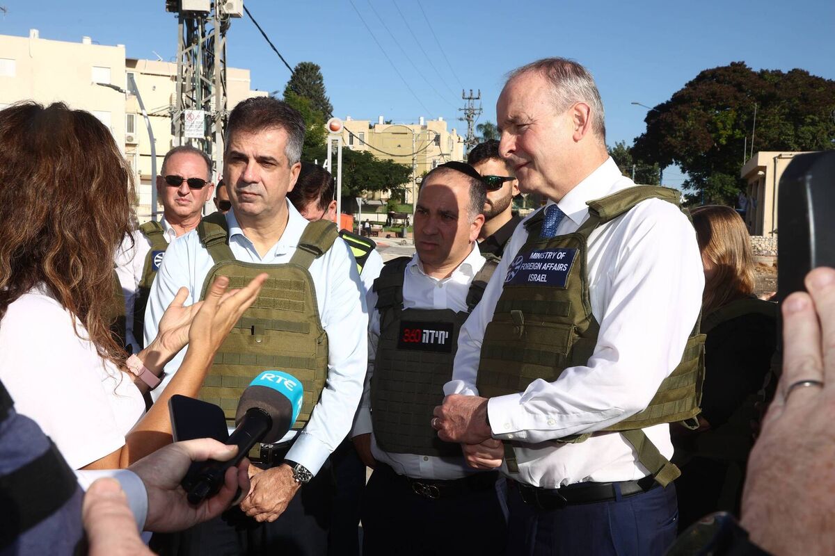 Tánaiste Micheál Martin and Israeli foreign minister Eli Cohen meeting local people in Sderot town which had suffered a rocket attack. Of Israel's attacks on Gaza, Mr Martin told Mr Cohen: 'What you are doing is creating fertile ground for more extreme views to grow.' Picture: Miri Shimonovich/DFA