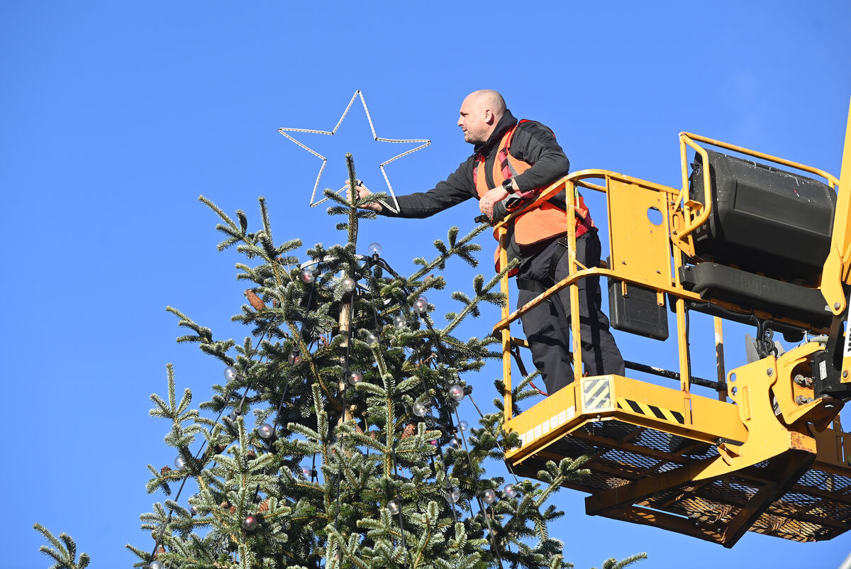  The star being put on the Christmas tree at The Coal Quay on Cornmarket Street. Picture: Eddie O'Hare