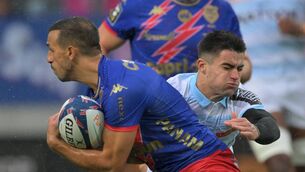 <p>DECENT AUDITION: Stade Francais' French full-back Kylan Hamdaoui (L) fights for the ball with Racing92's French scrum-half Nolann Le Garrec (R). Pic: MIGUEL MEDINA/AFP via Getty Images</p>