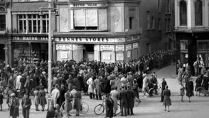 <p>Shoppers queue for the opening of the first Dunnes Stores on St Patrick's Street, Cork, on March 31, 1944. Ben Dunne was a scion of that business empire but his life was also touched by trauma, not least being kidnapped by the IRA. File picture: Irish Examiner Archive</p>