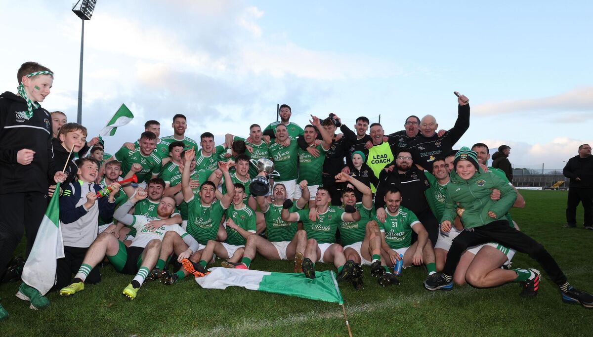 ELATION: The Milltown/Castlemaine team celebrate with the cup.