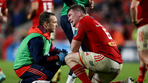 <p>INJURY CLOUD: Munster's Peter O'Mahony receives medical attention. Pic: ©INPHO/Ben Brady</p>