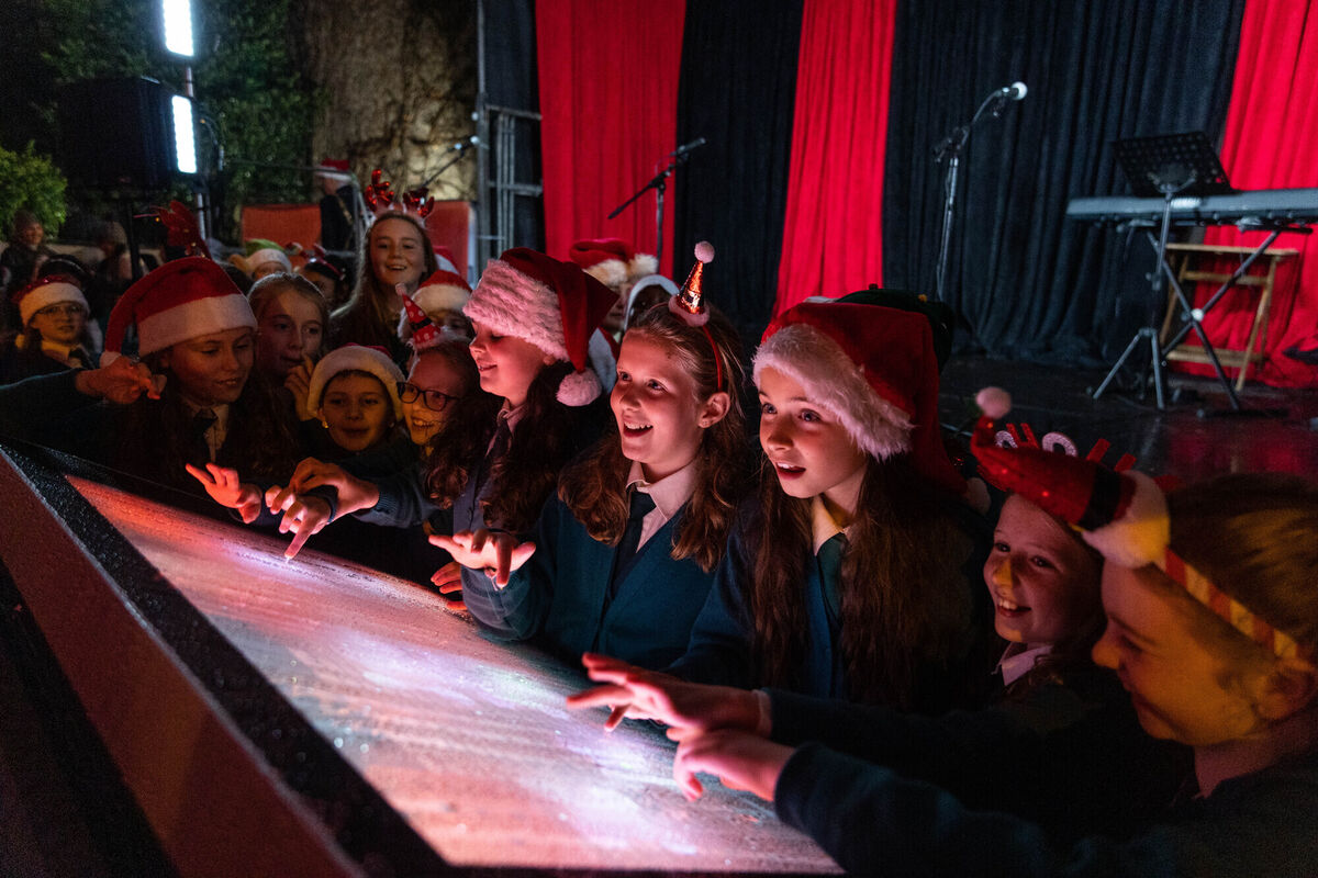 Members of the St Columba's Girls National School choir enjoying playing with the control panel for the SOLAS lights at the official opening of SOLAS, a magical immersive winter light experience on Emmet Place. Picture: Darragh Kane