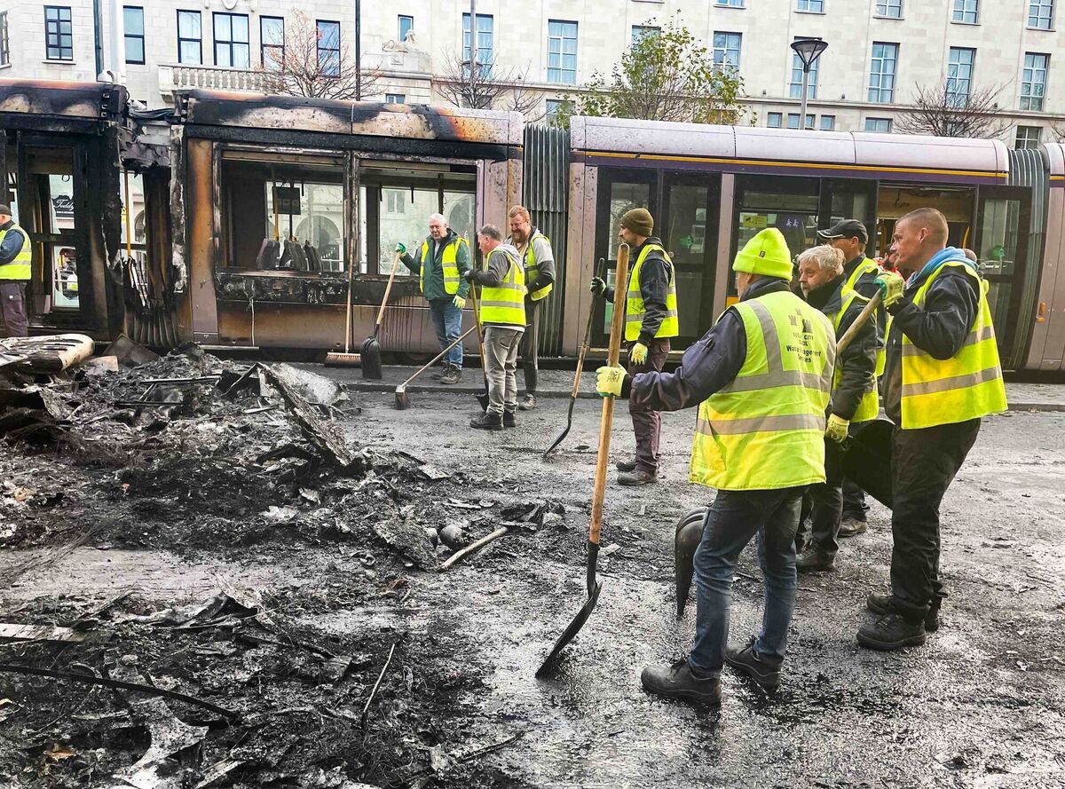 Pictured is a burned Luas carriage and Dublin City Council Waste Management services on O'Connell Street in Dublin this morning. Picture: Leon Farrell / RollingNews.ie