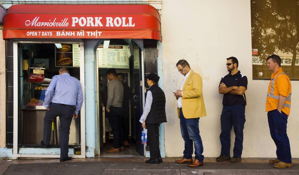 Customers queueing for a Vietnamese pork roll (banh mi thit) from the popular Marrickville Pork Roll around lunchtime. Customers queueing for a Vietnamese pork roll (banh mi thit) from the popular Marrickville Pork Roll around lunchtime.