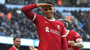 <p>SALUTE: Liverpool's Trent Alexander-Arnold celebrates after scoring his side's equaliser. Picture: AP Photo/Rui Vieira</p>