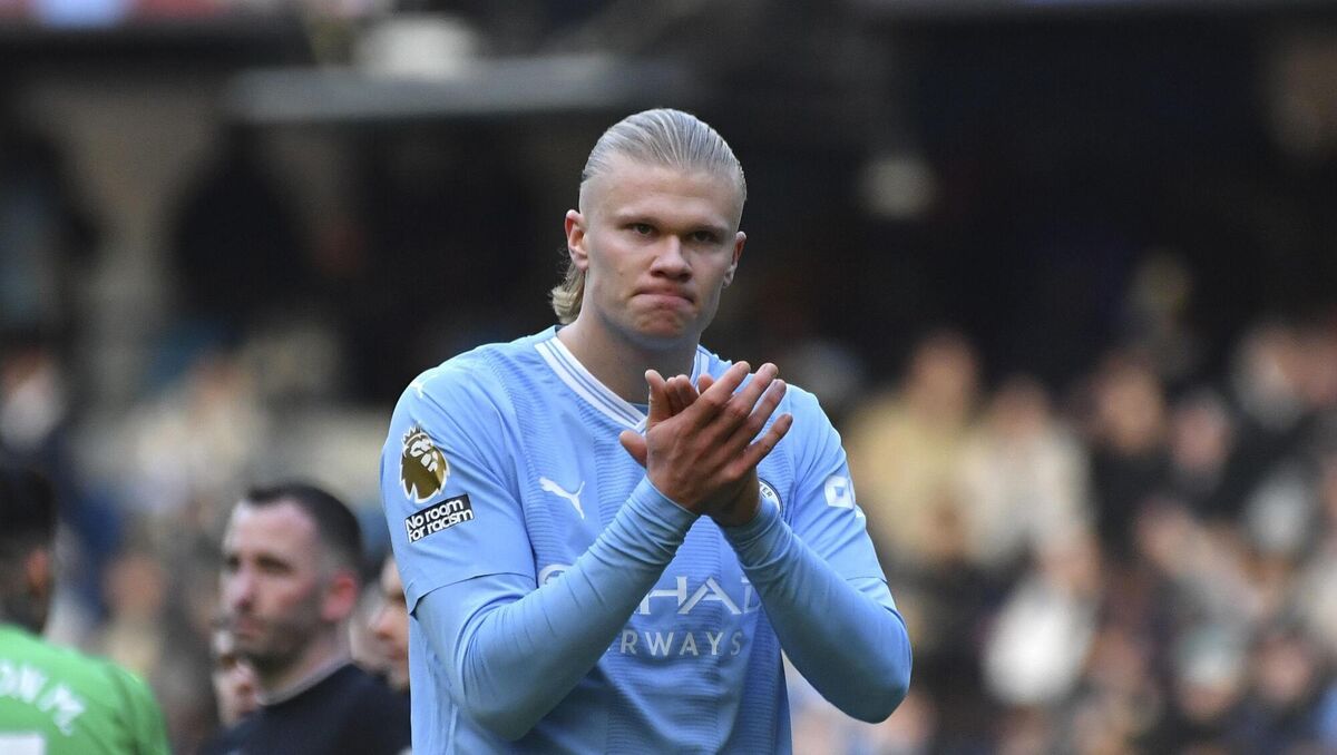 Manchester City's Erling Haaland applauds fans.