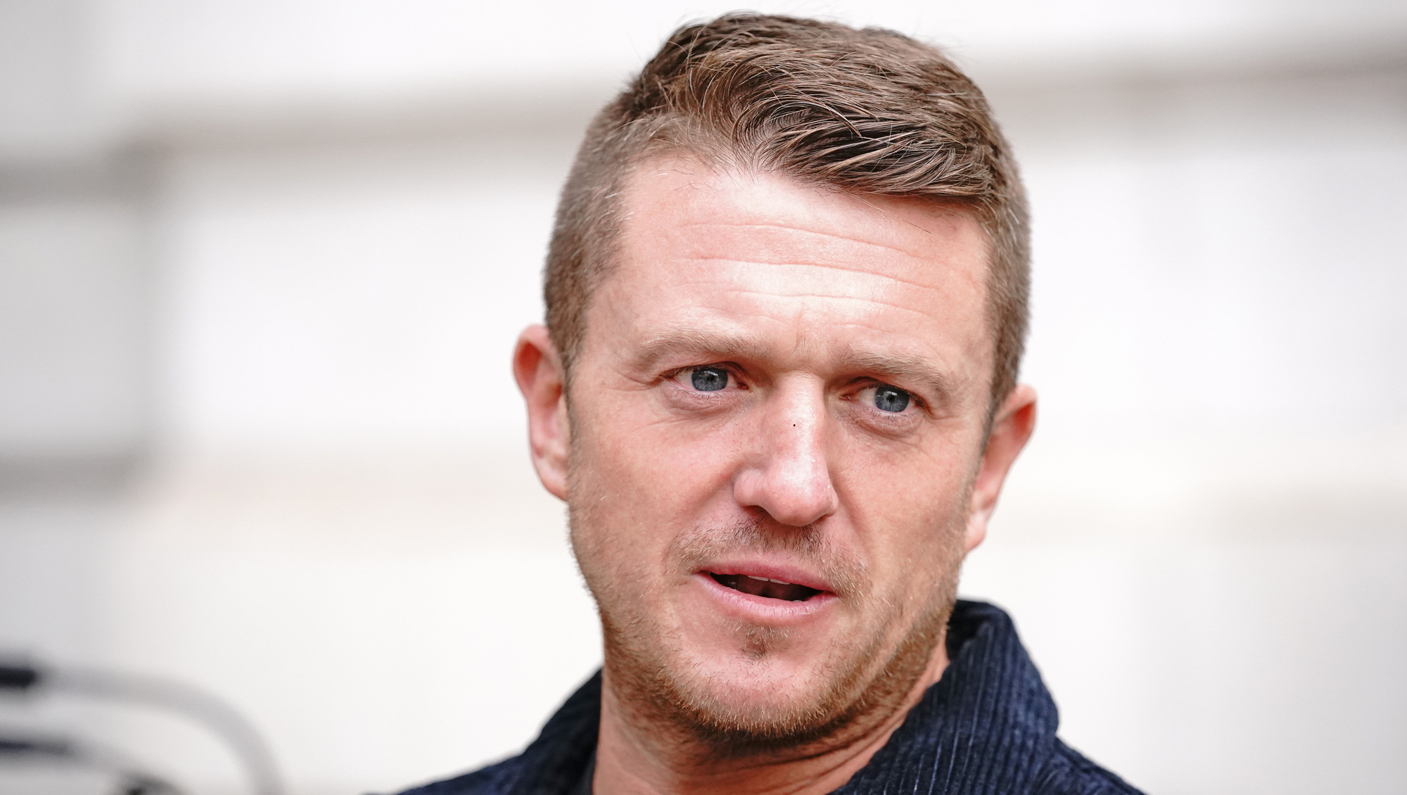 Tommy Robinson charged with criminal offence after arrest at antisemitism march
