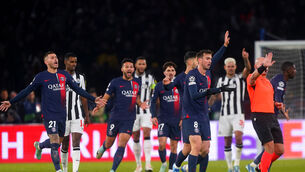 <p>WRONG CALL? Paris Saint-Germain players surround referee Szymon Marciniak as they appeal for the penalty.</p>