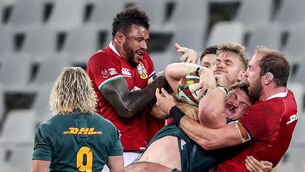 <p>OPEN TO CALL: South Africa's Jasper Wiese is tackled by Courtney Lawes, Chris Harris and Alun Wyn Jones of the British &amp; Irish Lions. Pic: ©INPHO/Dan Sheridan</p>