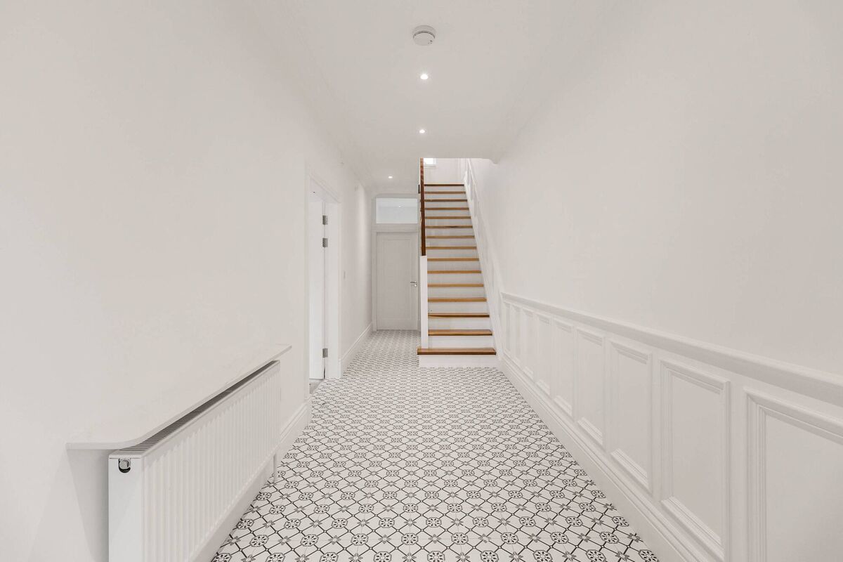 Wide hall with white marble top above the radiator,  warm-to-the-touch