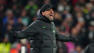 <p>Jurgen Klopp was delighted to take top spot with a game to spare (Peter Byrne/PA)</p>
