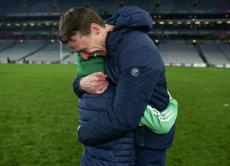 O'Loughlin Gaels manager Brian Hogan celebrates with his son Jack Hogan.