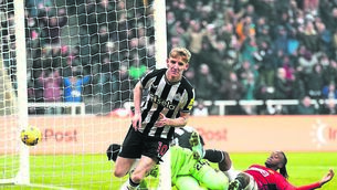 <p>Newcastle United’s Anthony Gordon celebrates after opening the scoring 10 minutes into the second half in their Premier League clash with Manchester United at St James’ Park.	Picture: Owen Humphreys/PA</p>