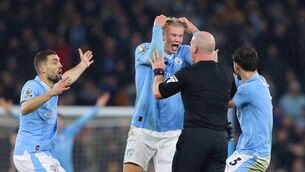<p>OUTRAGE: Referee Simon Hooper is surrounded by Erling Haaland, Mateo Kovacic and Ruben Dias after he stopped the game to award City a free kick </p>