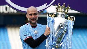 <p>EXPECTANT: Manchester City manager Pep Guardiola poses for a photograph with the Premier League winner's trophy.</p>