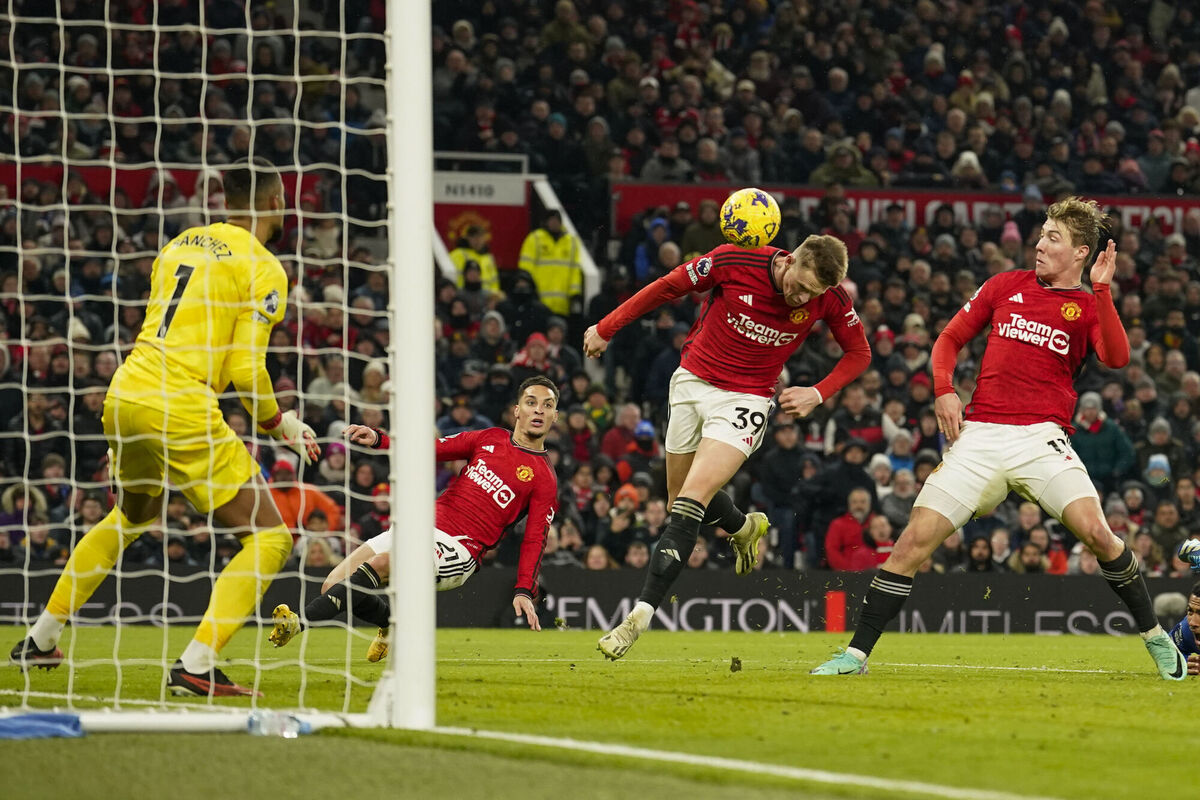 Manchester United's Scott McTominay, center, scores his side's second goal during the English Premier League soccer match between Manchester United and Chelsea at Old Trafford stadium in Manchester, England, Wednesday, Dec. 6, 2023. (AP Photo/Dave Thompson)