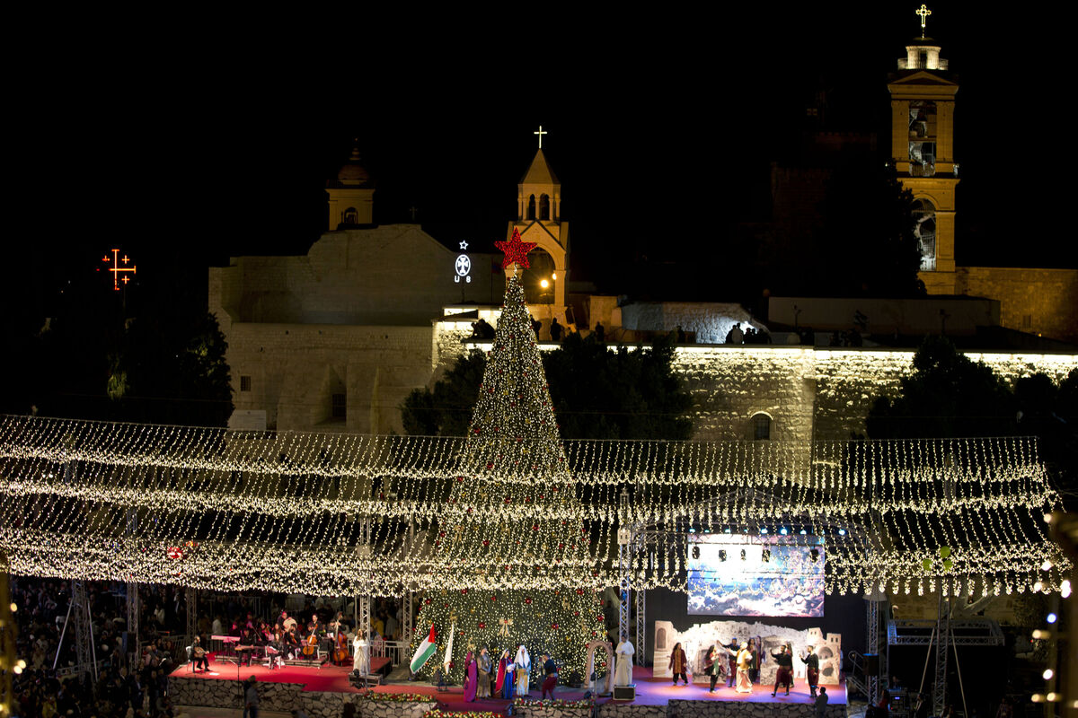 Palestinian Christians celebrate the lighting of a Christmas tree outside the Church of the Nativity, believed to be the birthplace of Jesus Christ, in the West Bank Palestinian city of Bethlehem, in 2019. Picture: Majdi Mohammed/AP