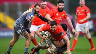 <p>Jack O'Sullivan is tackled by Uzair Cassiem during his time at Scarlets.  Photo by Ramsey Cardy/Sportsfile</p>
