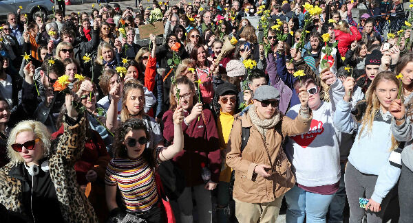 Holding yellow flowers as a sign of support at the I Believe Her solidarity rally at City Hall, Cork yesterday. Picture: Jim Coughlan Holding yellow flowers as a sign of support at the I Believe Her solidarity rally at City Hall, Cork yesterday. Picture: Jim Coughlan