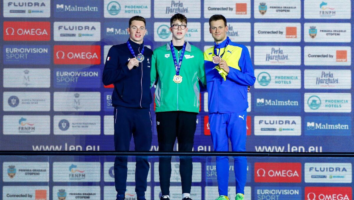 Armagh's Wiffen receives his gold medal alongside silver medallist David Aubry of France, left, and Ukraine's bronze medallist Mykhailo Romanchuk