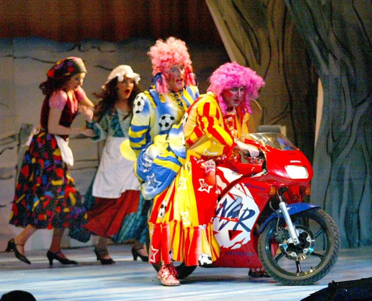 Cinderella's two ugly sisters, Frank Twomey and Eoin Hally, arrive on stage on a motorbike in the panto, Cinderella, at the Everyman Palace Theatre, in 2005. Pic: Cillian Kelly