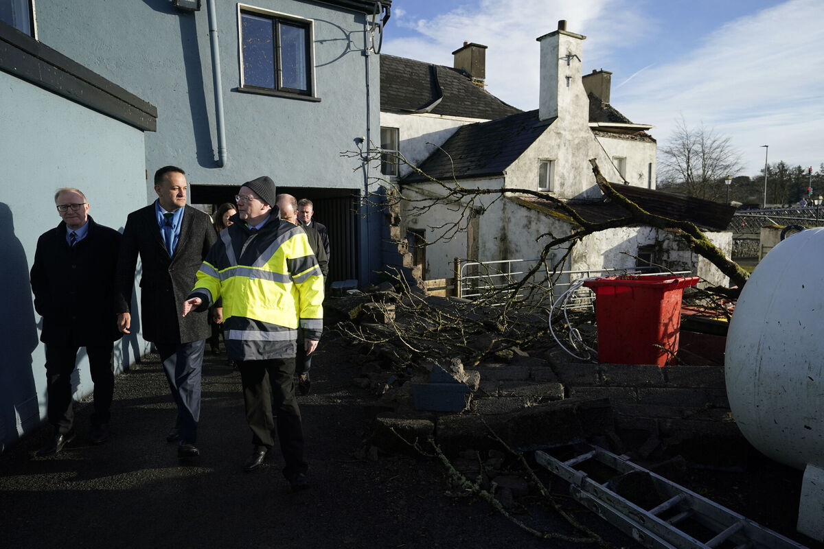 Taoiseach Leo Varadkar (second left) views the damage to properties in Leitrim Village in Co Leitrim. Picture: Niall Carson/PA Wire