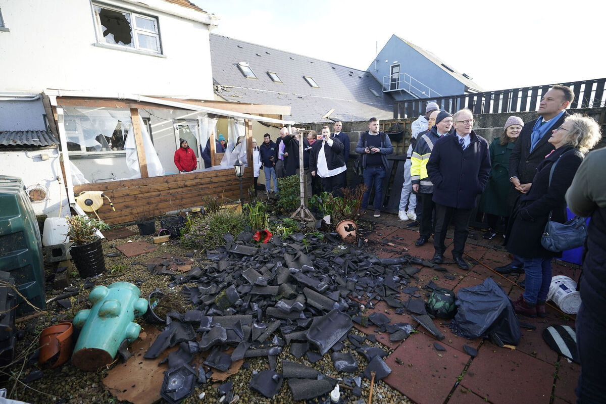 Taoiseach Leo Varadkar (right) views the damage to a house and garden in Leitrim Village in Co Leitrim. Picture: Niall Carson/PA Wire