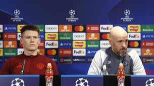<p>Manchester United's Scott McTominay (left) and manager Erik ten Hag during a press conference.</p>