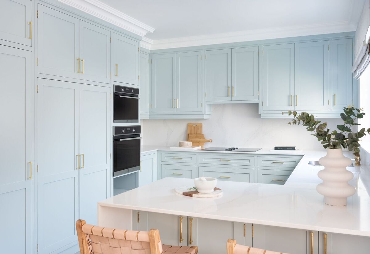  Aoife Tobin's kitchen design uses pastel with gold accents for a spring-like feel to keep the space airy and light all year round.
