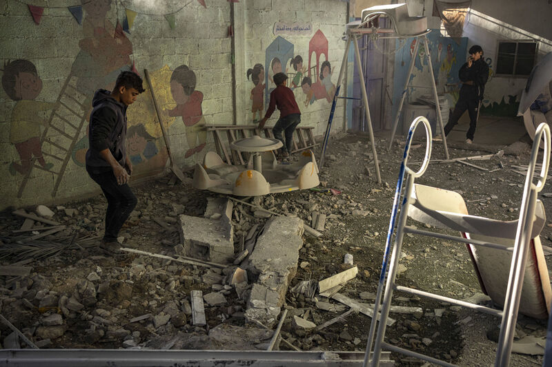 Palestinians look at houses destroyed in the Israeli bombardment of the Gaza Strip in Rafah. Picture: Fatima Shbair/AP Photo Palestinians look at houses destroyed in the Israeli bombardment of the Gaza Strip in Rafah. Picture: Fatima Shbair/AP Photo