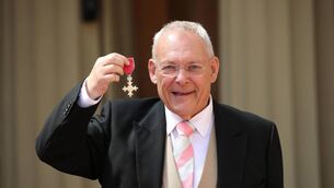 <p>British TV sports presenter Gary Newbon poses with his medal after being appointed a Member of the Order of the British Empire (MBE) during an investiture ceremony at Buckingham Palace in London on May 16, 2019. (Photo by Yui Mok / POOL / AFP) (Photo credit should read YUI MOK/AFP via Getty Images)</p>