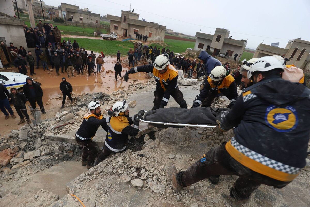 Members of the Syrian civil defence, known as the White Helmets transport a casualty pulled from the rubble following an earthquake in the town of Zardana in the countryside of the northwestern Syrian Idlib province in February. Picture: Getty Members of the Syrian civil defence, known as the White Helmets transport a casualty pulled from the rubble following an earthquake in the town of Zardana in the countryside of the northwestern Syrian Idlib province in February. Picture: Getty