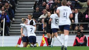 <p>Tottenham’s Martha Thomas is surrounded by her teammates after scoring the only goal of the game against Arsenal. Pic: Eddie Keogh/Getty Images</p>