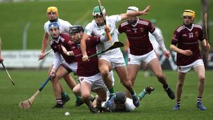 <p>Cushendall's Neil McManus and Paddy Deegan of O’Loughlin Gaels'</p>