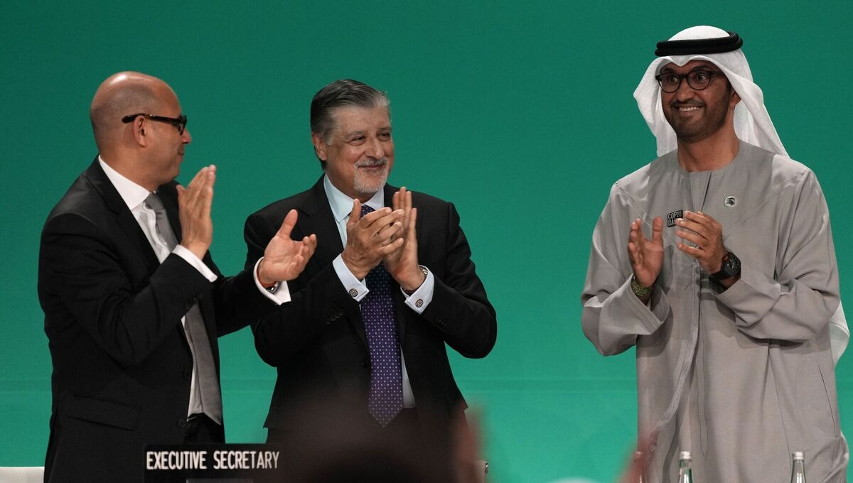 Cop28 president Sultan al-Jaber, right, celebrates passing the global stocktake with United Nations climate chief Simon Stiell, left, and Cop28 CEO Adnan Amin during a plenary session at the Cop28 UN Climate Summit in Dubai, United Arab Emirates. Picture: Kamran Jebreili/AP Photo Cop28 president Sultan al-Jaber, right, celebrates passing the global stocktake with United Nations climate chief Simon Stiell, left, and Cop28 CEO Adnan Amin during a plenary session at the Cop28 UN Climate Summit in Dubai, United Arab Emirates. Picture: Kamran Jebreili/AP Photo