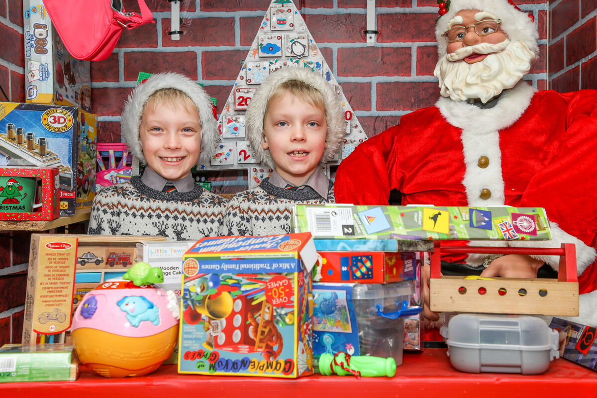 Twins Billy and Donnacha Lingwood at Santa's workshop in the school.