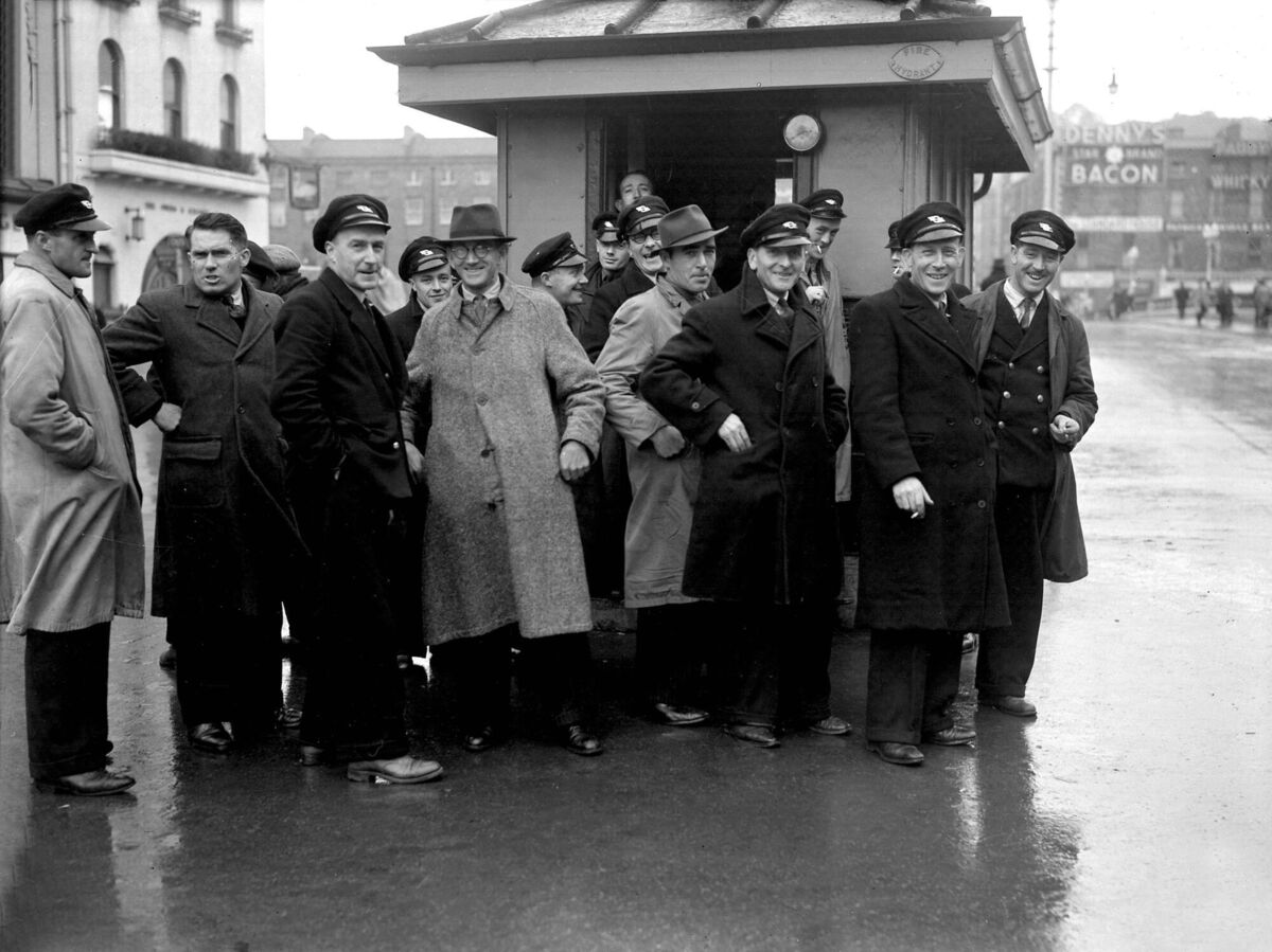 CIE employees gather at the busman's hut on St Patrick's Street during a bus strike in 1947.