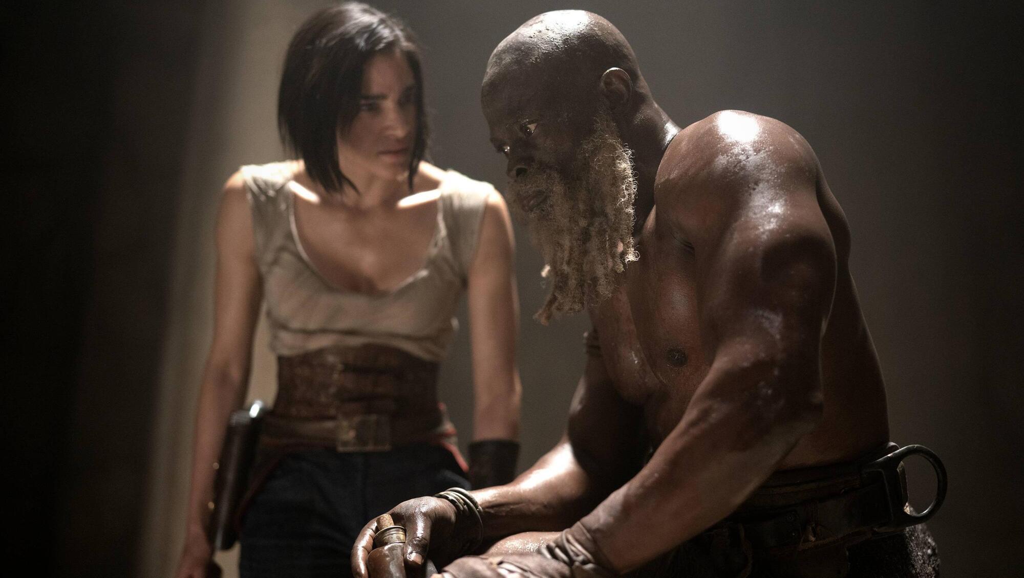 Sofia Boutella as Kora and Djimon Hounsou as Titus in Rebel Moon.