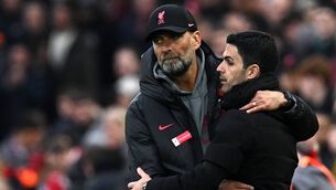 <p>DIFFERENT STAGES: Liverpool's German manager Jurgen Klopp (L) embraces Arsenal's Spanish manager Mikel Arteta after the English Premier League football match between Liverpool and Arsenal at Anfield in April.</p>