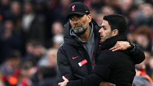 <p>FRIENDS AGAIN: Liverpool's manager Jurgen Klopp (L) embraces Arsenal's manager Mikel Arteta after the English Premier League football match between Liverpool and Arsenal at Anfield in Liverpool, north west England on April 9, 2023. - The match ended 2-2. (Photo by Paul ELLIS / AFP) </p>