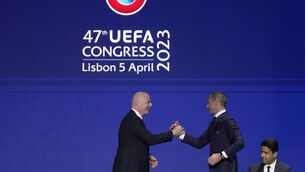 <p>Gianni Infantino, left, president of FIFA, shakes hands with Aleksander Ceferin, president of UEFA, after delivering a speech at the start of the 47th ordinary UEFA congress in Lisbon, Wednesday, April 5, 2023. (AP Photo/Armando Franca)</p>