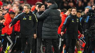 <p>Arsenal manager Mikel Arteta (left) and Liverpool manager Jurgen Klopp embrace after the final whistle in the Premier League match at Anfield, Liverpool. Picture: Peter Byrne/PA Wire. </p>