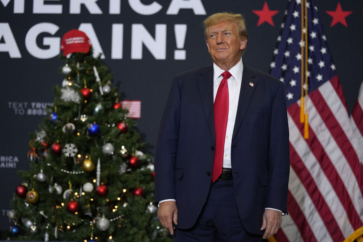 Former US president Donald Trump soaking up the applause of his supporters at a caucus rally in Waterloo, Iowa, just before Christmas. Picture: Charlie Neibergall/AP Former US president Donald Trump soaking up the applause of his supporters at a caucus rally in Waterloo, Iowa, just before Christmas. Picture: Charlie Neibergall/AP