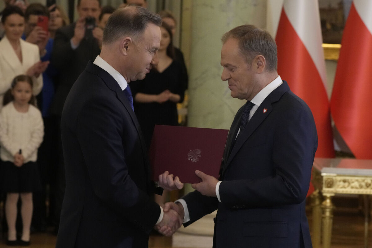 Poland's President Andrzej Duda shakes hands with the newly-elected prime minister Donald Tusk during his swearing-in ceremony at the presidential palace in Warsaw. Picture: Czarek Sokolowski/AP Poland's President Andrzej Duda shakes hands with the newly-elected prime minister Donald Tusk during his swearing-in ceremony at the presidential palace in Warsaw. Picture: Czarek Sokolowski/AP