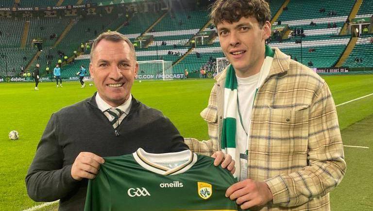 David Clifford presents Celtic manager Brendan Rodgers with signed Kerry jersey